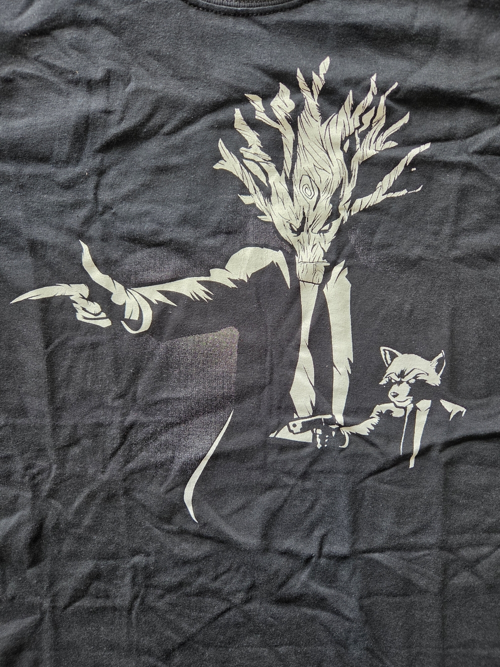 Black Graphic Tee with Tree-Headed Character and Raccoon